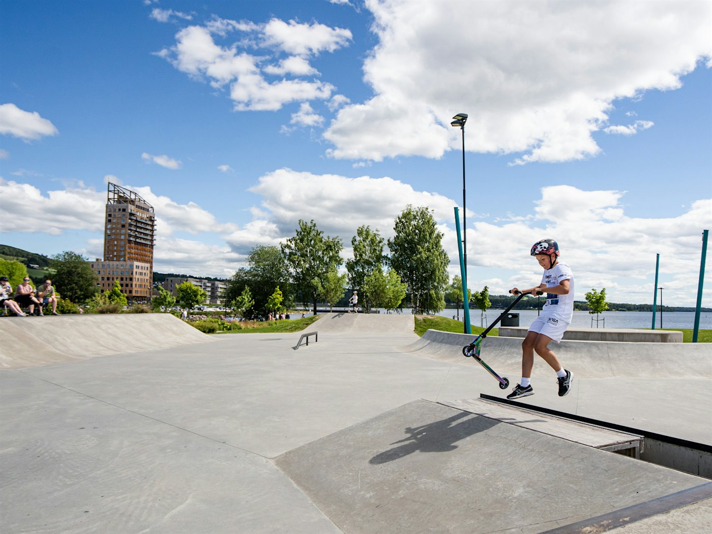 Boy on scooter in skatepark. Photo