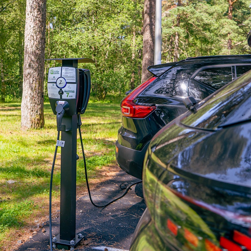 Charging station for electric cars, two pictures stand for charging. Photo